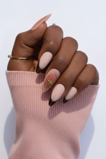 Hand with blush pink sleeve