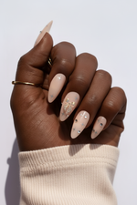 Hand with cream/nude sleeve